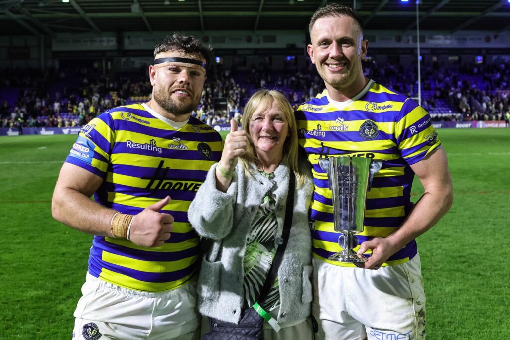 Locker's Julie Whiteley presenting the Locker Cup to Joe Philbin and Ben Currie